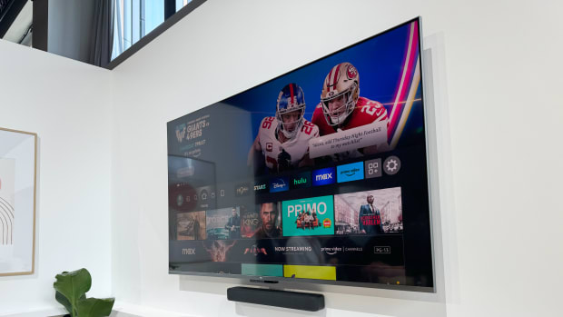 Amazon's new Fire TV Soundbar mounted underneath a Fire TV.